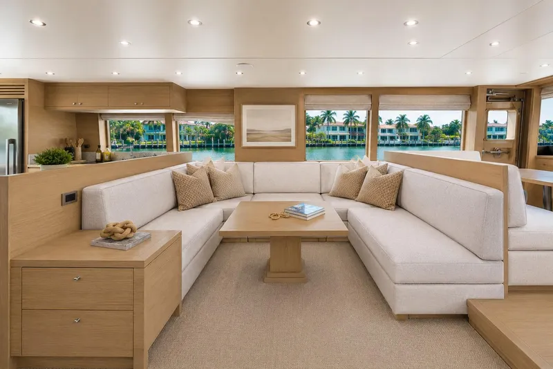Slide: The Image of Luxurious interior of 2026 Offshore Yachts CE Series with elegant seating and scenic views. - 3