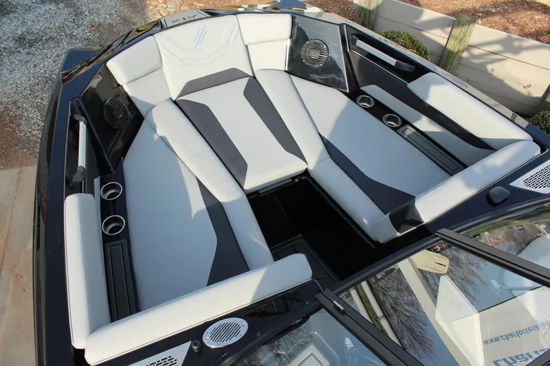 Slide: The Image of 2026 ATX Surf Boats 24 Type-S interior with sleek seating and cup holders. - 16