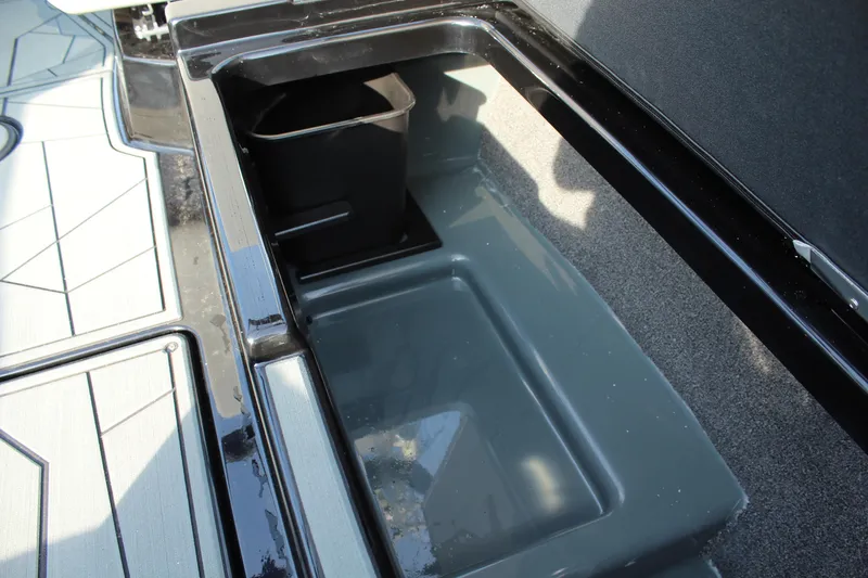 Slide: The Image of Storage compartment in 2026 ATX Surf Boats 24 Type-S, featuring sleek design and practical utility. - 18