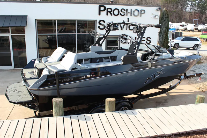 Slide: The Image of 2026 ATX Surf Boats 24 Type-S displayed at a pro shop, sleek design and modern features. - 2