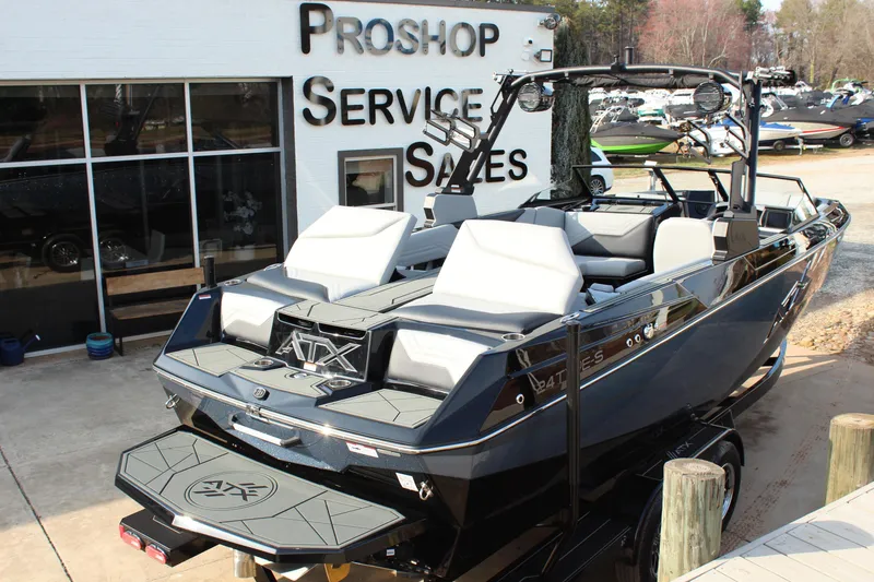 Slide: The Image of 2026 ATX Surf Boats 24 Type-S displayed at a pro shop service and sales center. - 4
