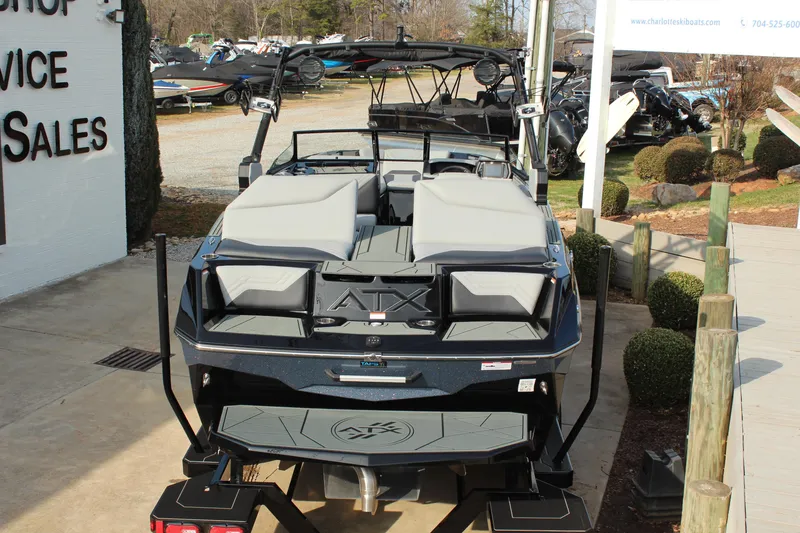 Slide: The Image of 2026 ATX Surf Boats 24 Type-S displayed at a dealership, rear view. - 5