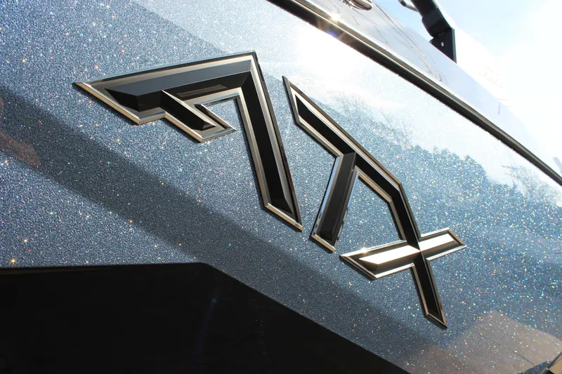 Slide: The Image of 2026 ATX Surf Boats 24 Type-S logo on glittery surface. - 9