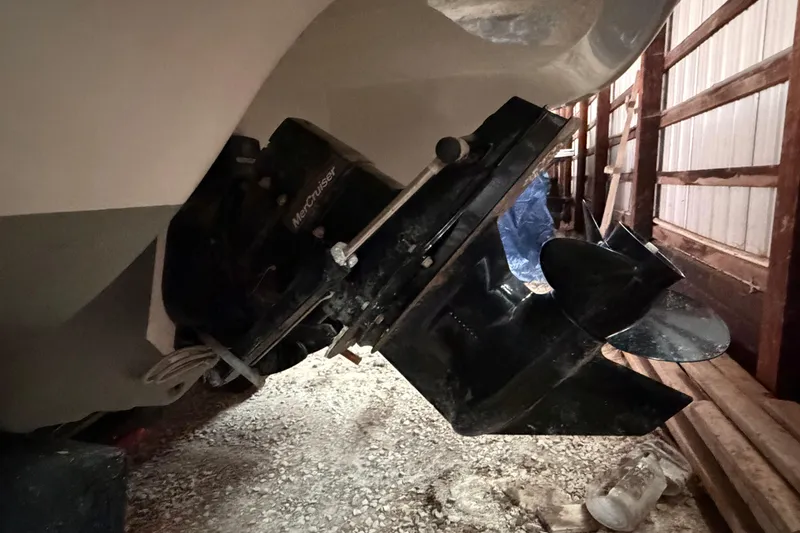 Slide: The Image of 2019 Stingray 208 LS boat with MerCruiser engine in a storage shed. - 11