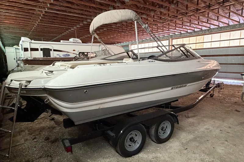Slide: The Image of 2019 Stingray 208 LS boat on trailer in storage facility. - 6