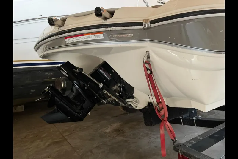 Slide: The Image of 2019 Stingray 208 LS boat stern with MerCruiser outdrive and red safety strap. - 9