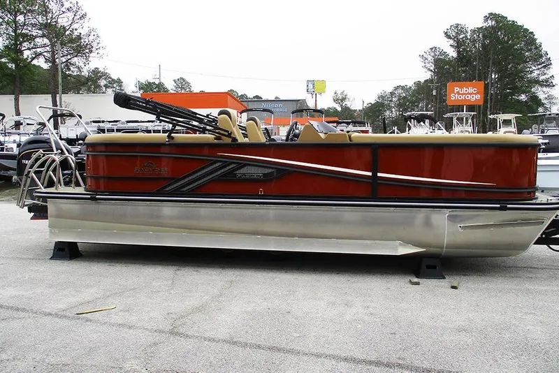 The Image of 2026 SunCatcher Fusion 322RC pontoon boat displayed outdoors. - 1