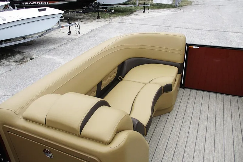 Slide: The Image of Luxurious seating on 2026 SunCatcher Fusion 322RC boat, featuring beige upholstery. - 11