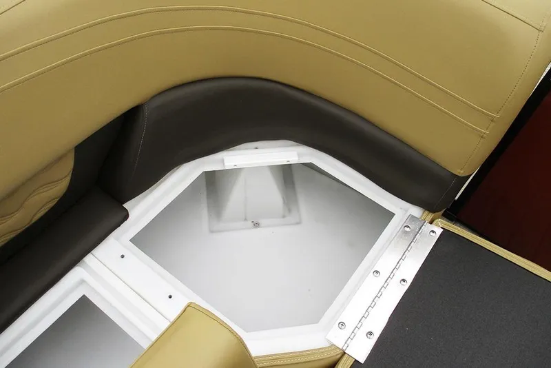 Slide: The Image of SunCatcher Fusion 322RC 2026 boat storage compartment with tan and black seating. - 13