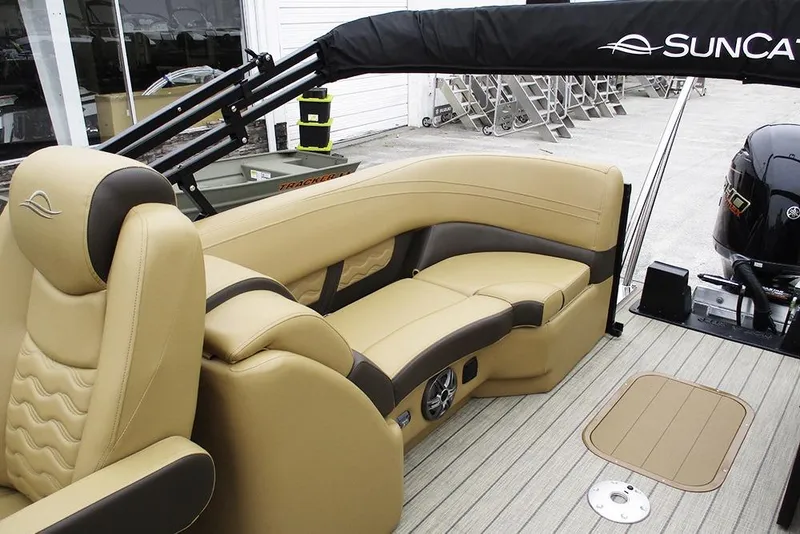 Slide: The Image of Luxurious interior of 2026 SunCatcher Fusion 322RC boat with beige seating and modern design. - 21