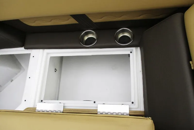 Slide: The Image of Interior storage compartment of 2026 SunCatcher Fusion 322RC with cup holders. - 26