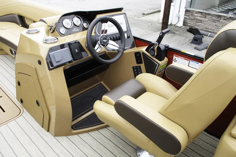 Slide: The Image of 2026 SunCatcher Fusion 322RC boat interior with beige seats and modern dashboard. - 28