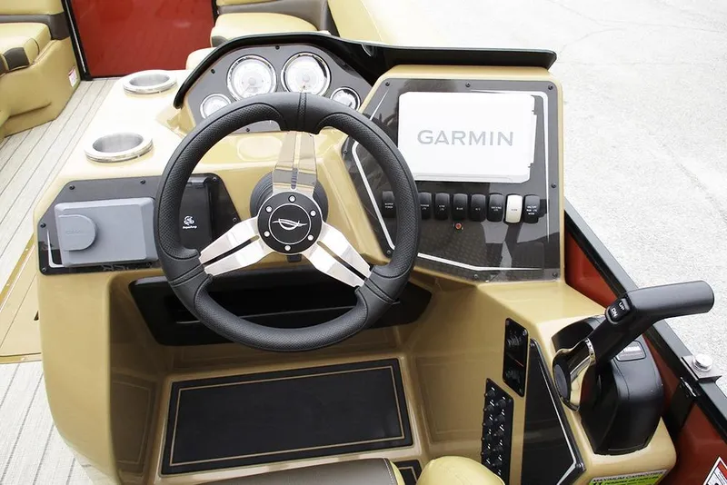 Slide: The Image of Steering console of 2026 SunCatcher Fusion 322RC with Garmin navigation system. - 29
