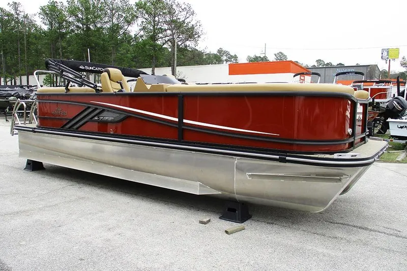 Slide: The Image of 2026 SunCatcher Fusion 322RC pontoon boat in vibrant red, displayed outdoors. - 3