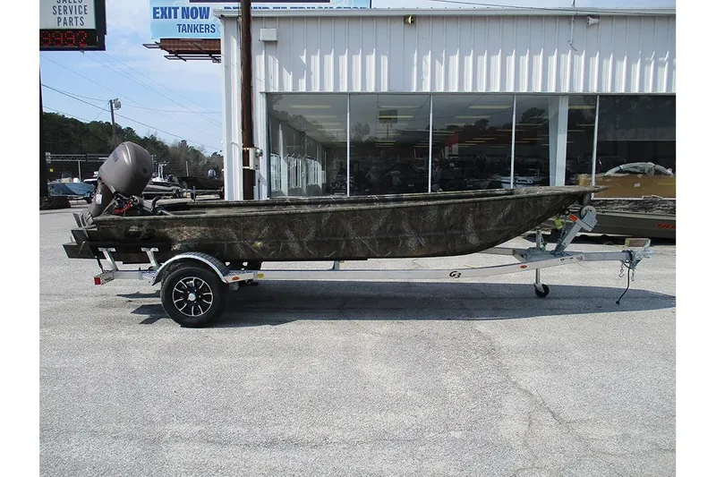 Slide: The Image of 2026 G3 Gator Tough 16 DK boat on trailer outside dealership. - 5