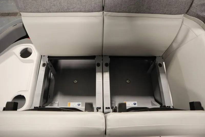 Slide: The Image of 2024 Sea-Doo Switch Cruise 21 interior storage compartment with gray seating. - 13