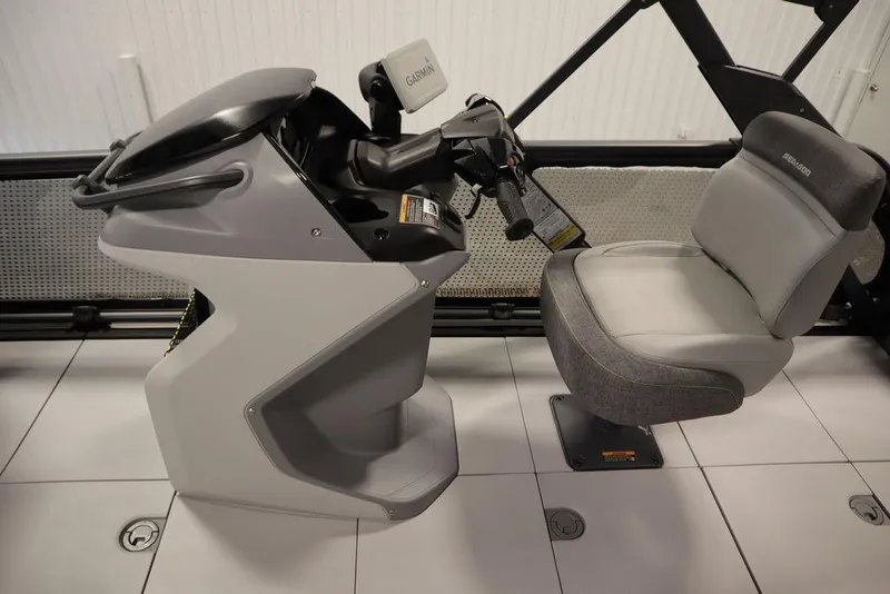 Slide: The Image of 2024 Sea-Doo Switch Cruise 21 helm with Garmin display and comfortable seating. - 15