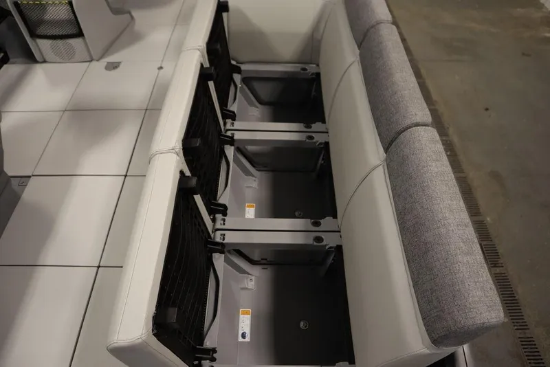 Slide: The Image of 2024 Sea-Doo Switch Cruise 21 interior seating with storage compartments. - 16