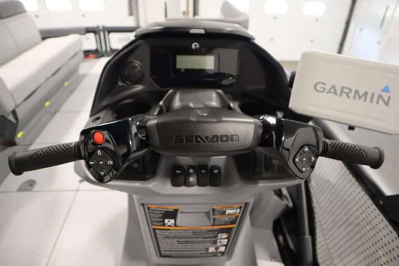 Slide: The Image of 2024 Sea-Doo Switch Cruise 21 dashboard with Garmin navigation system and ergonomic controls. - 17
