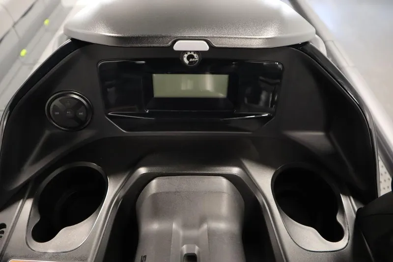 Slide: The Image of 2024 Sea-Doo Switch Cruise 21 dashboard with control panel and cup holders. - 26