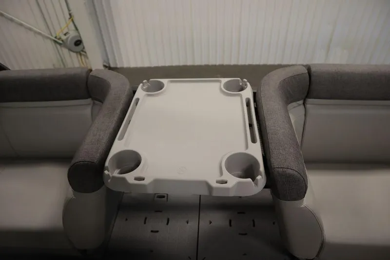 Slide: The Image of 2024 Sea-Doo Switch Cruise 21 interior with gray seating and a central table. - 27