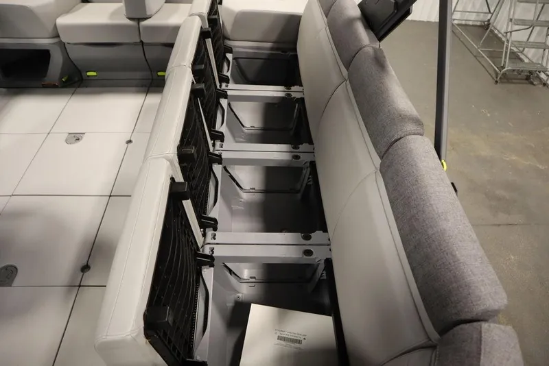 Slide: The Image of 2024 Sea-Doo Switch Cruise 21 interior seating with under-seat storage compartments. - 32