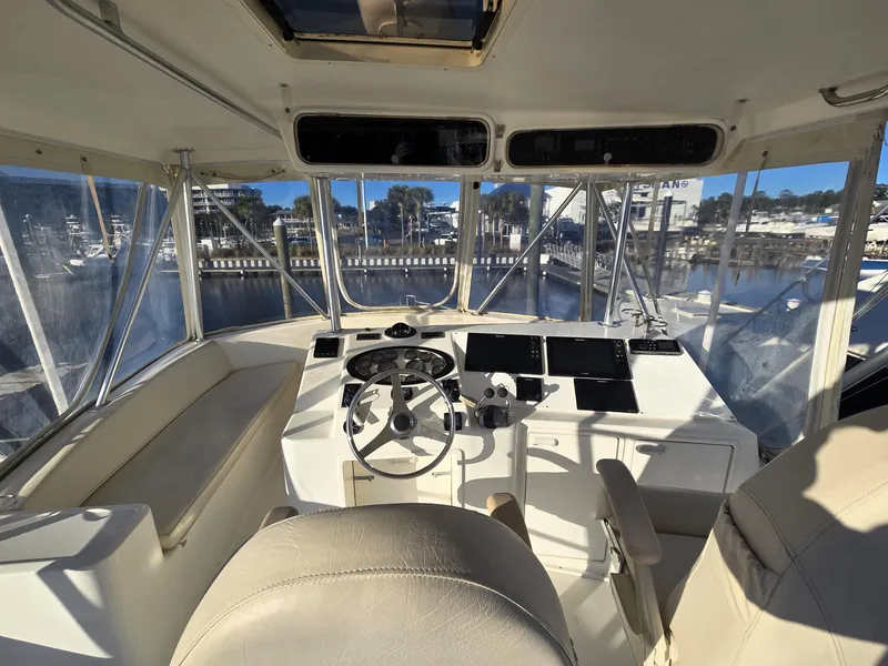 Slide: The Image of Interior view of 2001 Ocean Yachts 43 Super Sport cockpit with steering wheel and navigation equipment. - 21