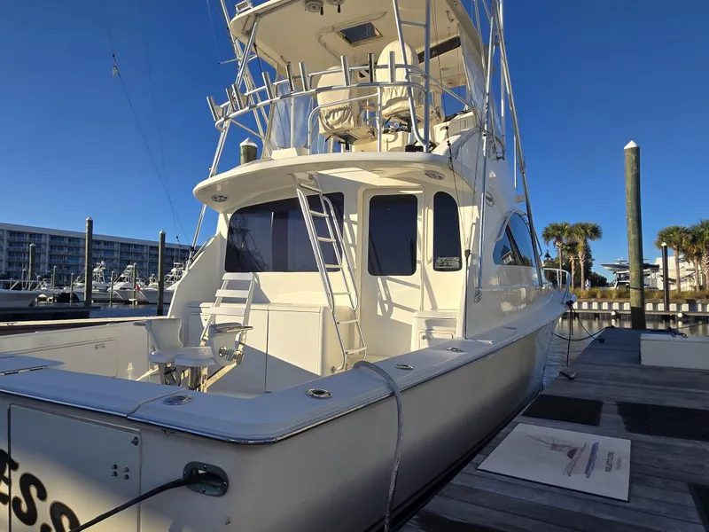 Slide: The Image of 2001 Ocean Yachts 43 Super Sport docked, showcasing sleek design and spacious deck. - 29