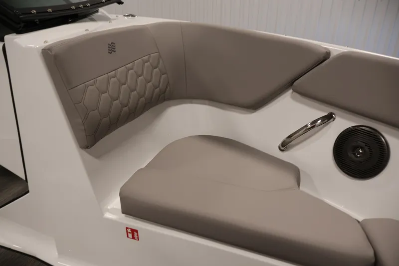 Slide: The Image of Interior seating of 2026 Four Winns H1 OB boat with modern design and speaker. - 12