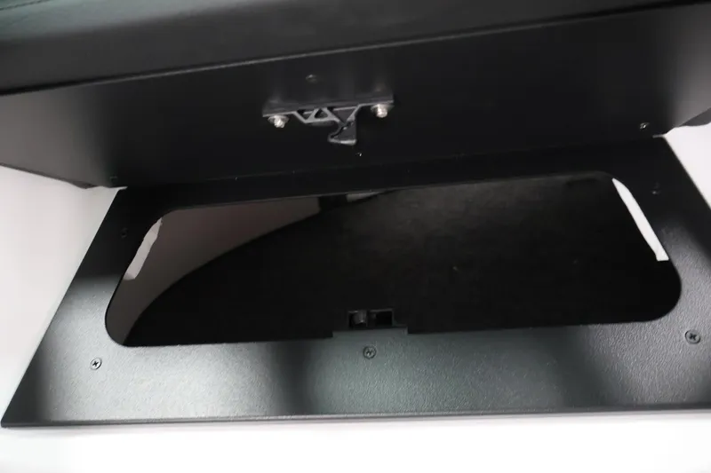 Slide: The Image of Storage compartment in 2026 Four Winns H1 OB boat, showcasing sleek design and functionality. - 26