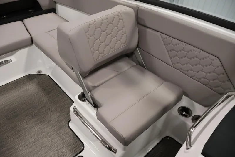 Slide: The Image of 2026 Four Winns H1 OB boat interior with gray cushioned seating and hexagonal stitching. - 27