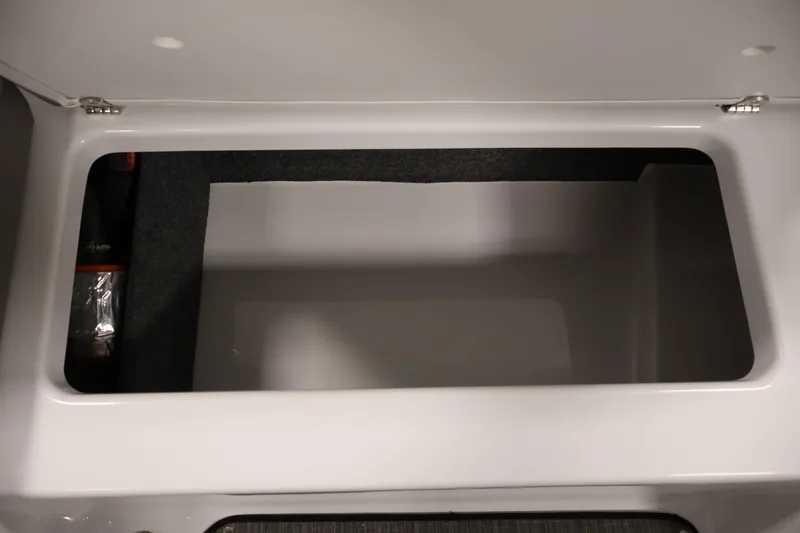 Slide: The Image of Storage compartment of 2026 Four Winns H1 OB boat, open and empty. - 31