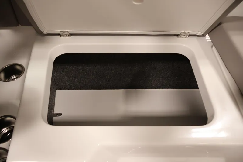 Slide: The Image of Open storage compartment in 2026 Four Winns H1 OB boat interior. - 33