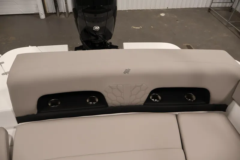 Slide: The Image of 2026 Four Winns H1 OB boat interior with cushioned seating and cup holders. - 34