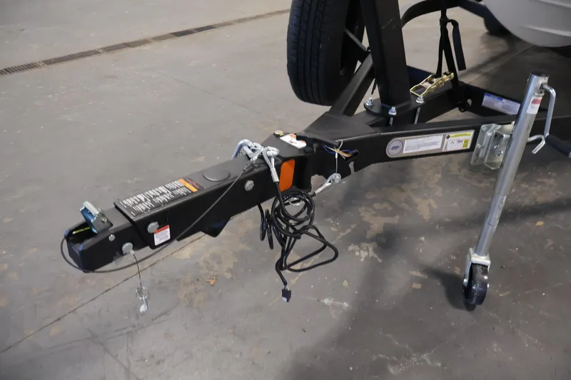 Slide: The Image of Trailer hitch of a 2026 Four Winns H1 OB boat on a concrete floor. - 40