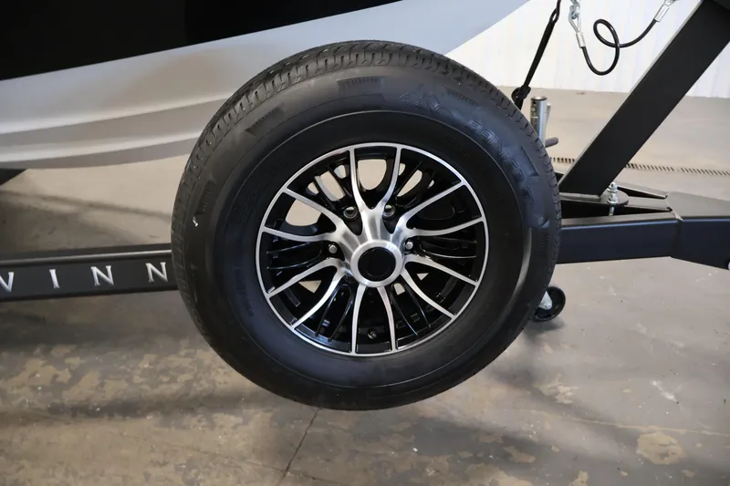 Slide: The Image of 2026 Four Winns H1 OB trailer wheel with sleek black alloy rim design. - 41