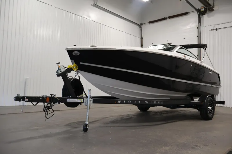 Slide: The Image of 2026 Four Winns H1 OB boat on trailer in indoor storage facility. - 42