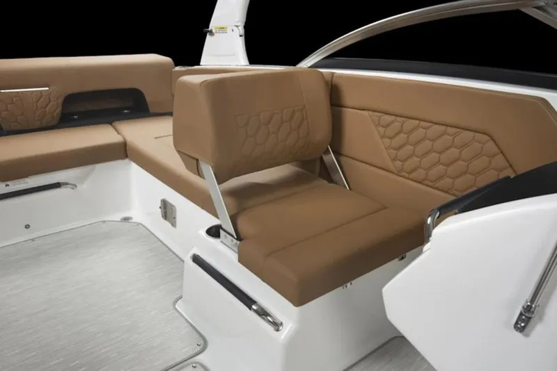 Slide: The Image of 2026 Four Winns H1 OB boat interior with brown cushioned seating and modern design. - 45