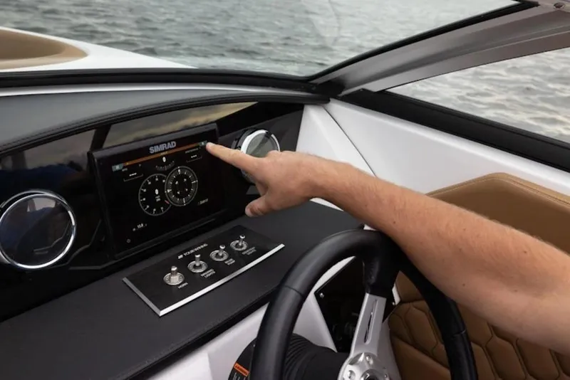 Slide: The Image of 2026 Four Winns H1 OB boat dashboard with touchscreen navigation system. - 5