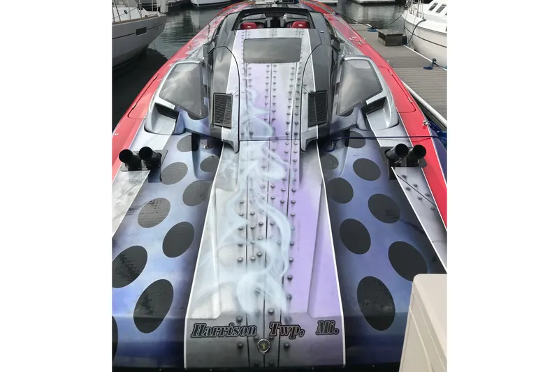 Slide: The Image of 2007 Nor-Tech 4700 Super Cat with custom paint, docked at a marina. - 11