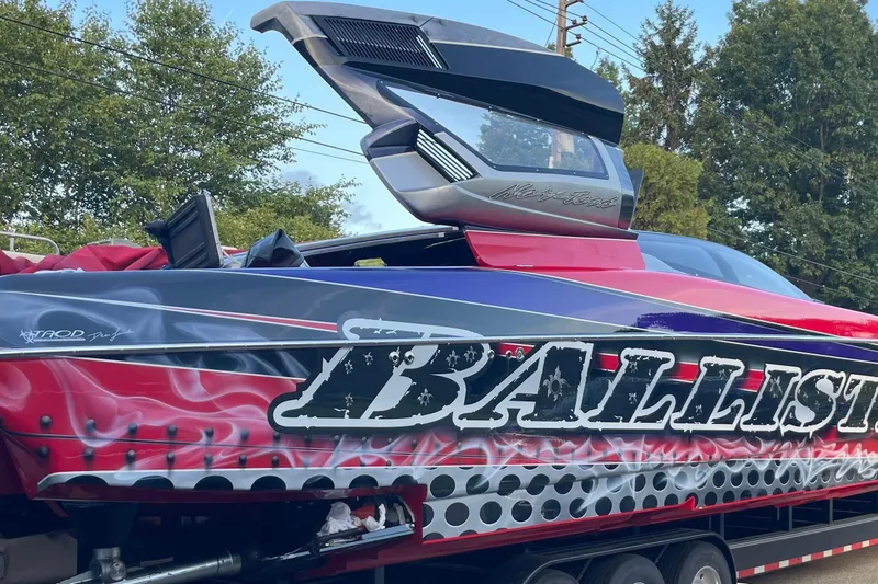 Slide: The Image of 2007 Nor-Tech 4700 Super Cat speedboat with vibrant graphics and "Ballistic" text. - 17