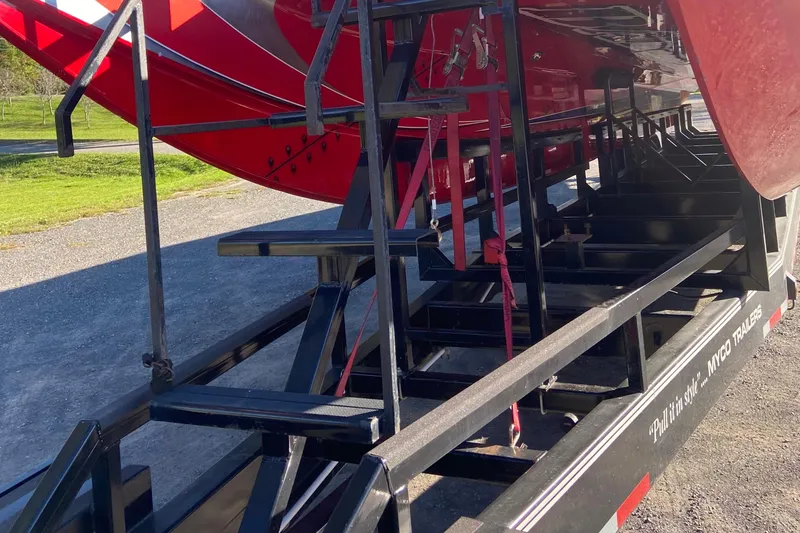 Slide: The Image of Red 2007 Nor-Tech 4700 Super Cat on a Myco trailer, parked outdoors. - 5