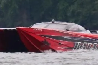 Slide: The Image of 2007 Nor-Tech 4700 Super Cat speedboat in action on the water, featuring a striking red design. - 8