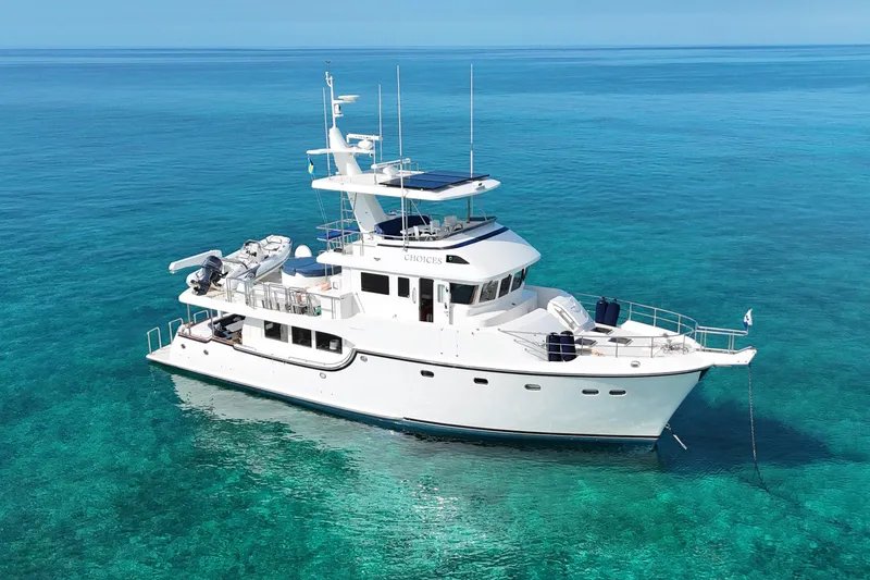 The Image of 2016 Nordhavn 60 yacht anchored in clear turquoise waters. - 0