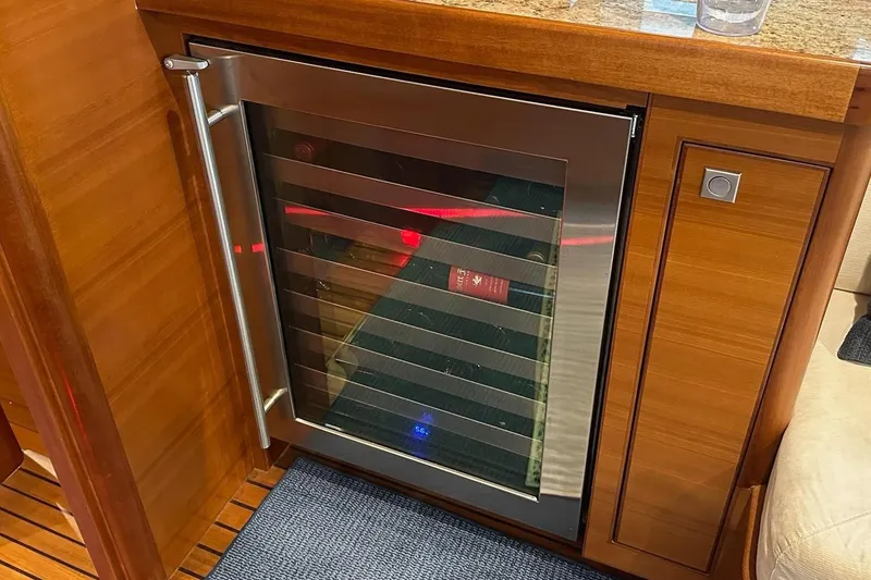 Slide: The Image of Luxury yacht interior with a built-in wine cooler, Nordhavn 60, 2016 model. - 12