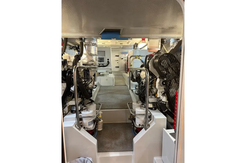 Slide: The Image of Engine room of a 2016 Nordhavn 60 yacht, showcasing machinery and equipment. - 27