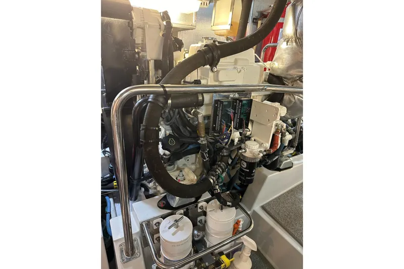Slide: The Image of Engine room of a 2016 Nordhavn 60 yacht, showcasing mechanical components and systems. - 29