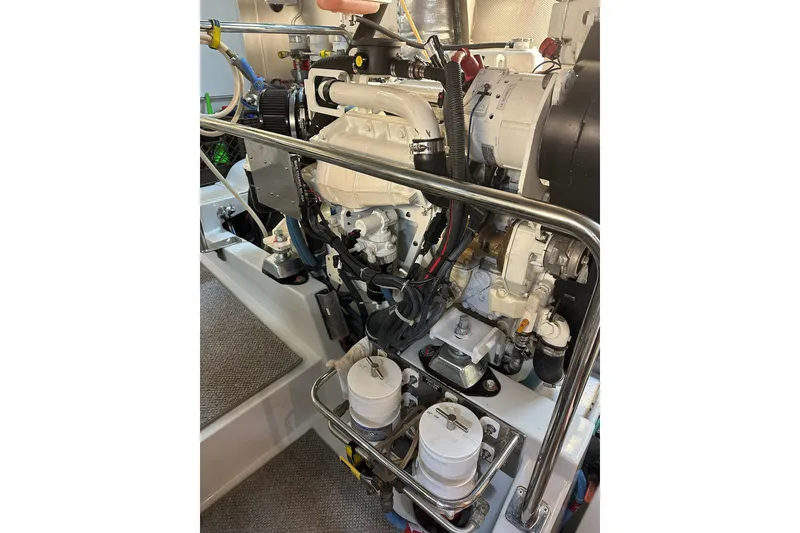 Slide: The Image of Engine room of a 2016 Nordhavn 60 yacht, showcasing detailed mechanical components. - 30