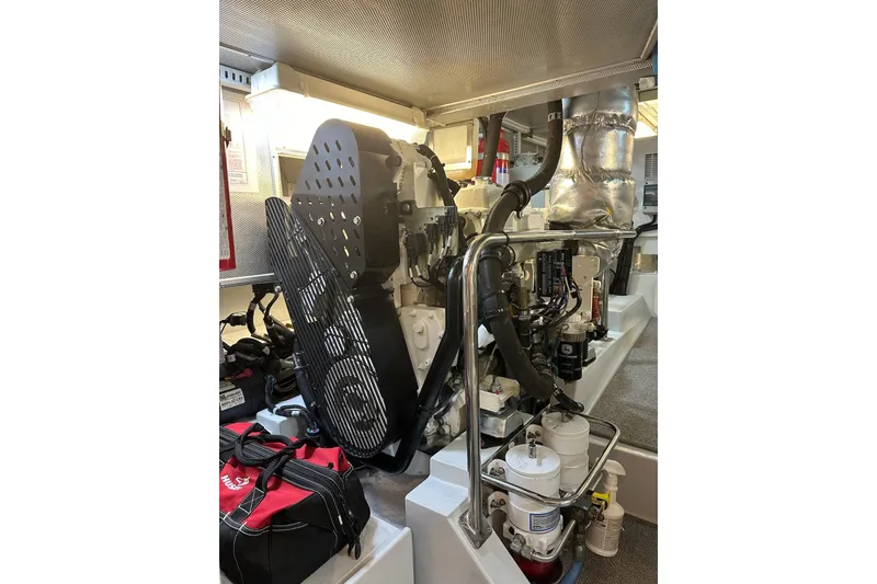 Slide: The Image of Engine room of a 2016 Nordhavn 60 yacht, showcasing mechanical components and equipment. - 31