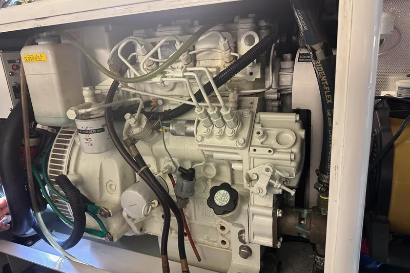 Slide: The Image of Engine compartment of a 2016 Nordhavn 60 yacht, showcasing detailed mechanical components. - 36